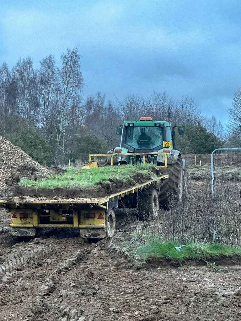 Tractor and trailer with turf sods
