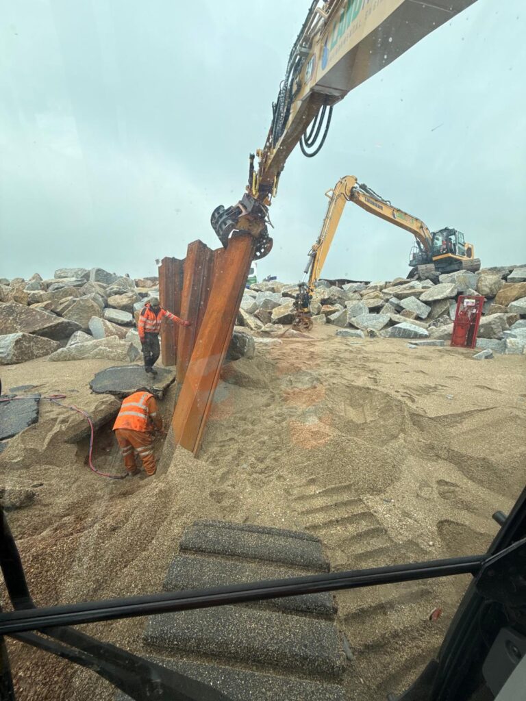 Excavators putting in rock armour