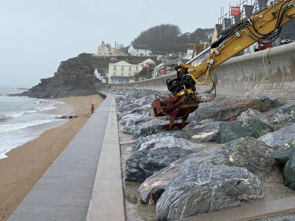 Winching the steel piles across the beach to tidy up at Torcross