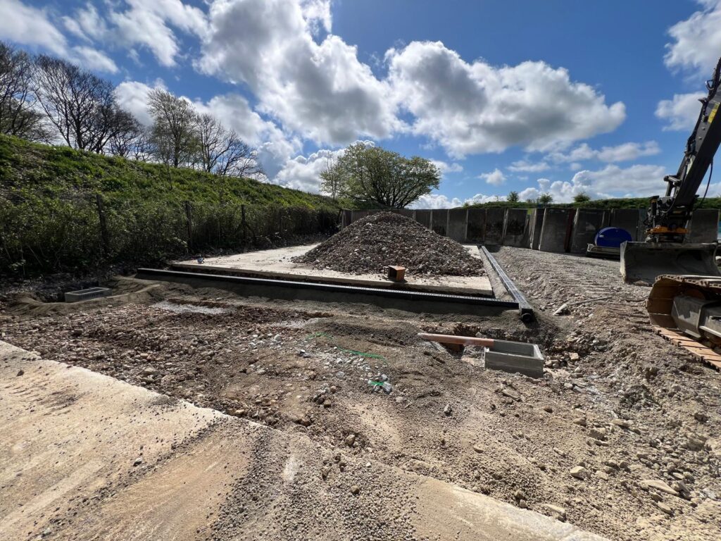 Surface water drainage channel installation at a recycling facility in Tavistock, Devon.